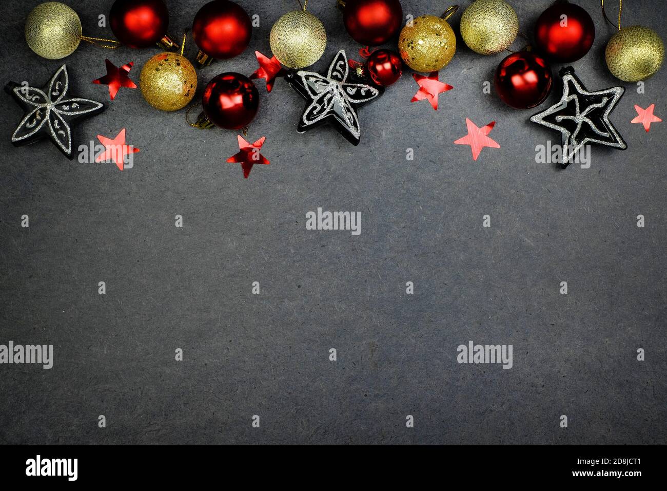 Christmas background with gold and silver decorations on black