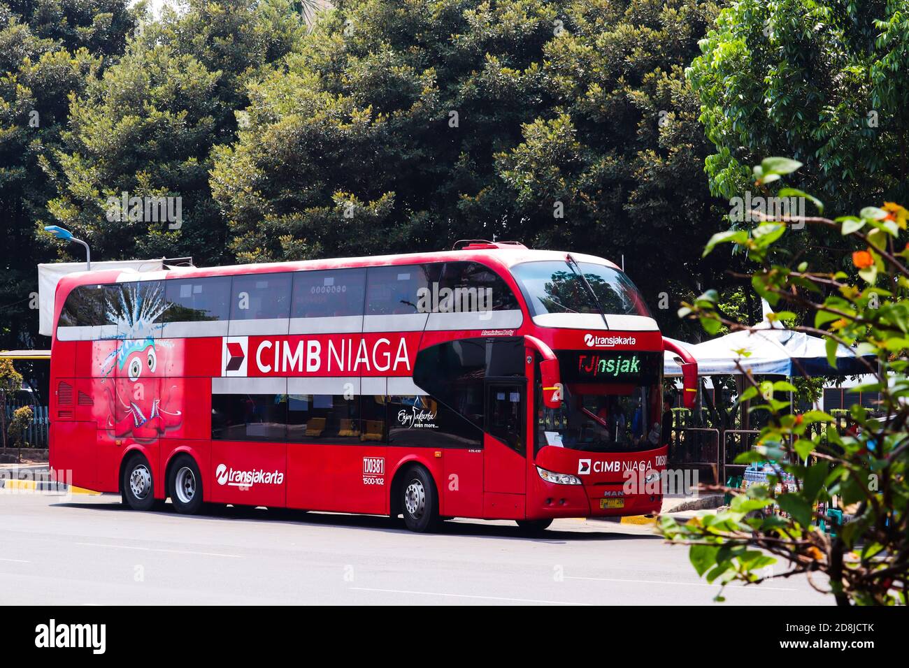 Jakarta / Indonesia - September 23, 2020. Parked two-level red tourist buses are waiting for tourists to tour the city of Jakarta. Stock Photo