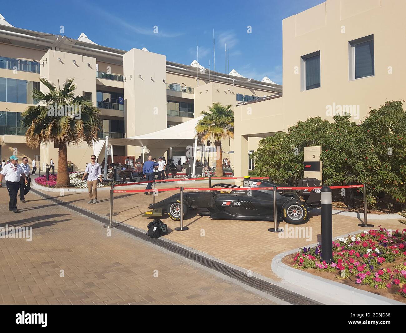Racing car on display in front of the buildings at Yas Marina Circuit ...