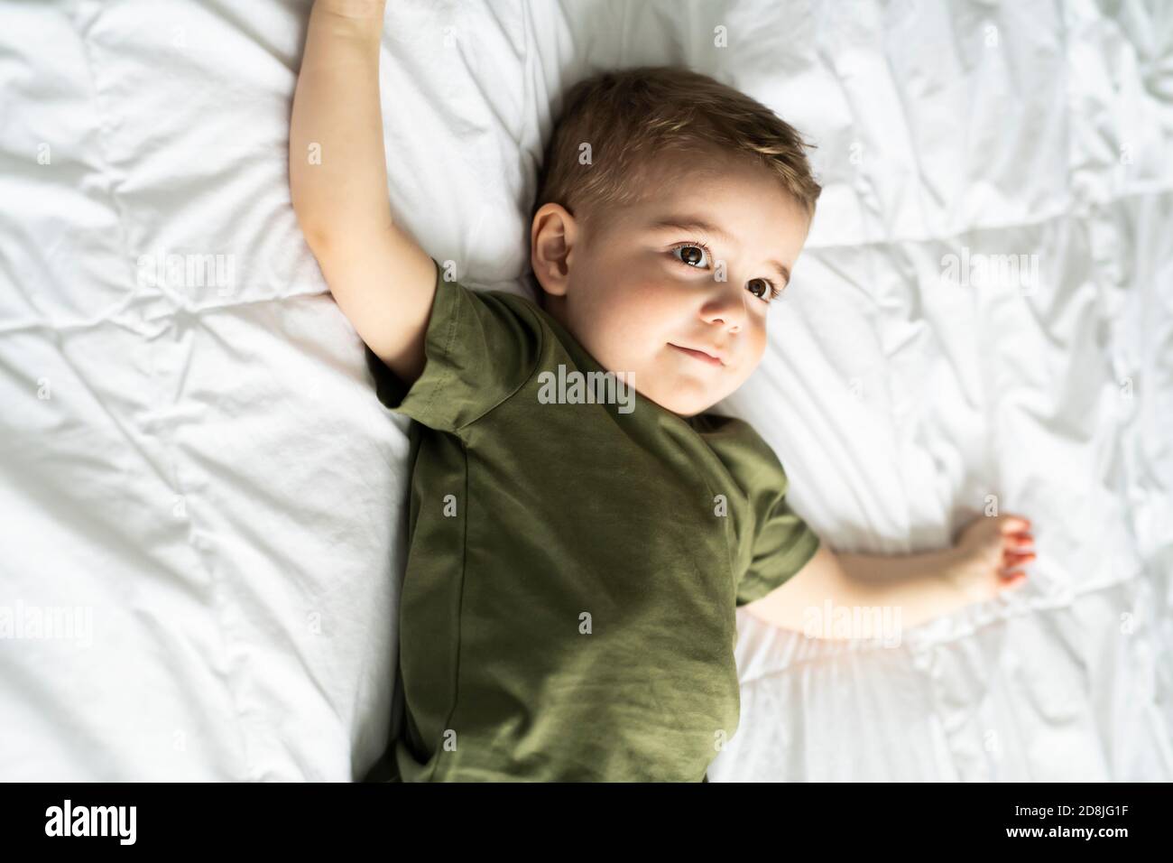 A two years old boy on bed portrait Stock Photo Alamy