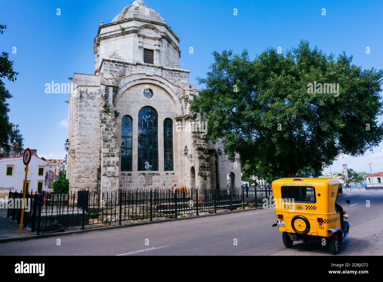 A coco-taxi next to the Iglesia de San Francisco de Paula, Havana is part of the ecclesiastical heritage of Havana. It is near the bay on the south si Stock Photo