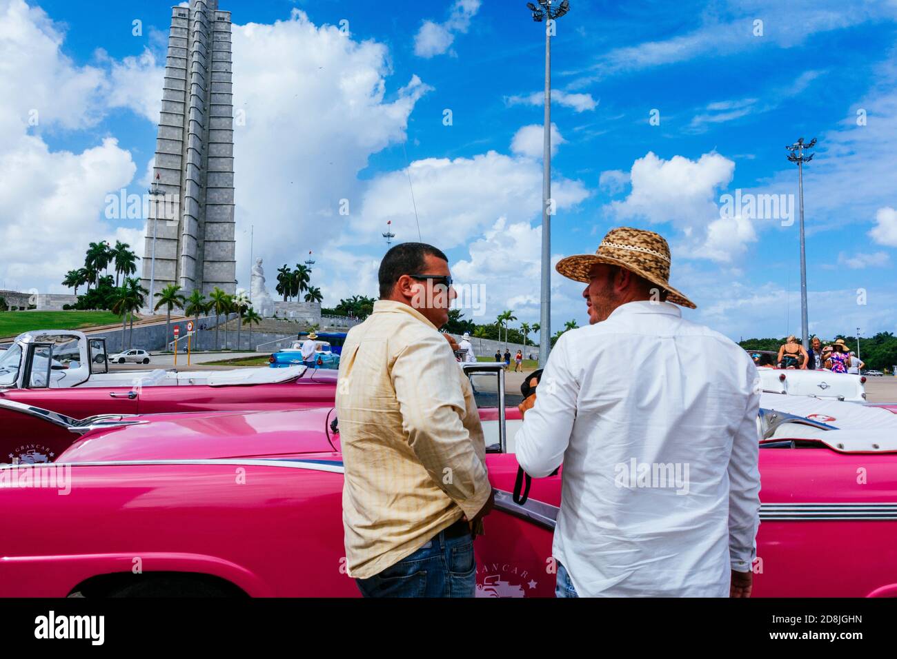 Taxi drivers talk in the Revolution Square - Plaza de la revolución, with the Monument to honor José Martí in the background. La Habana - La Havana, C Stock Photo