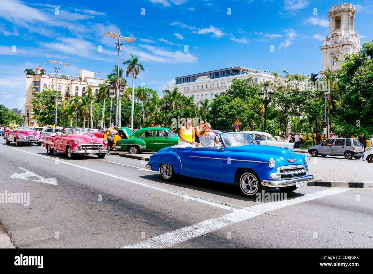 Female tourists ride in a vintage taxi - Almendrón - around the Central Park - Parque Central. Havana. Cuba, Latin America and the Caribbean Stock Photo