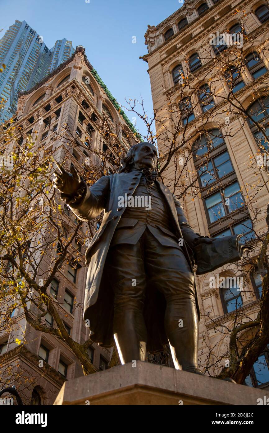 New York, USA 11/25/2017: Close up image of the Benjamin Franklin statue, located in lower Manhattan at a public park. This historical landmark was bu Stock Photo