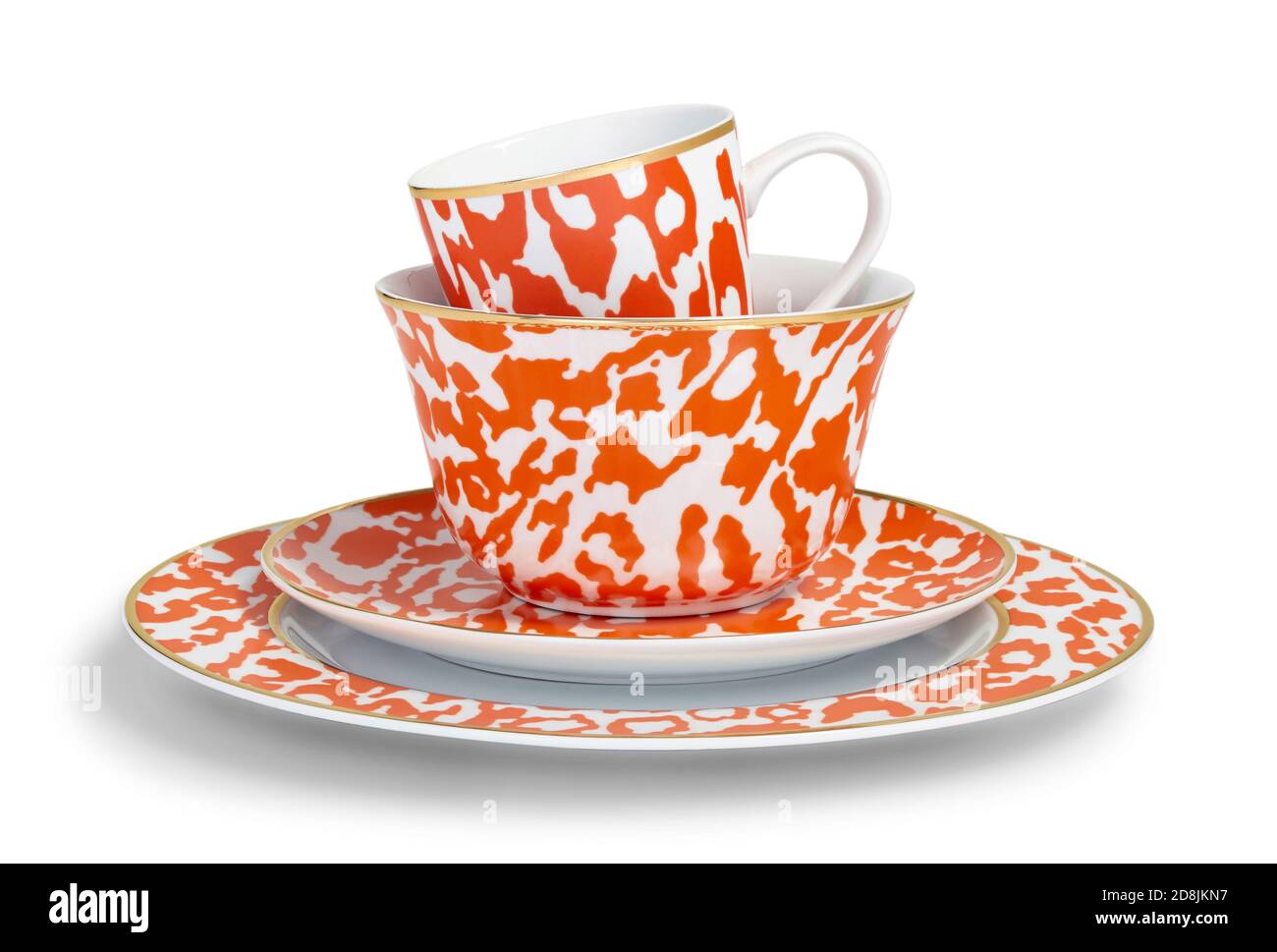 Leopard orange dinnerware set with plate, bowl, cup, and saucer from the Fall 2013 C.Wonder Look Book photographed on a white background. Stock Photo