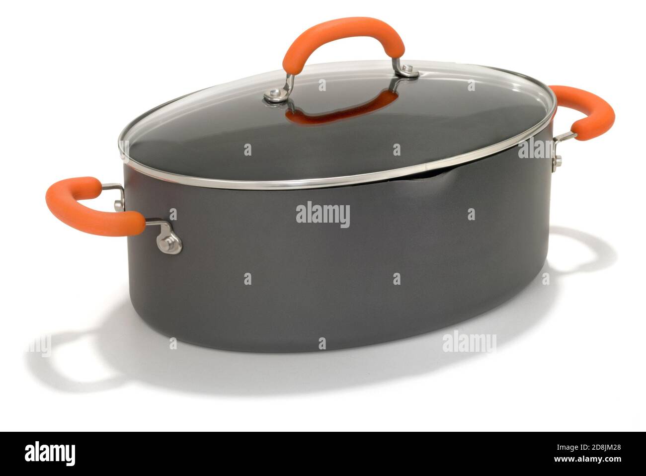 Oval shaped, non stick pasta pot with orange handles photographed on a  white background Stock Photo - Alamy