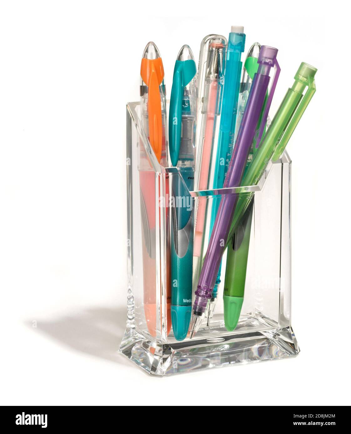 glass desktop pen and pencil holder photographed on a white background