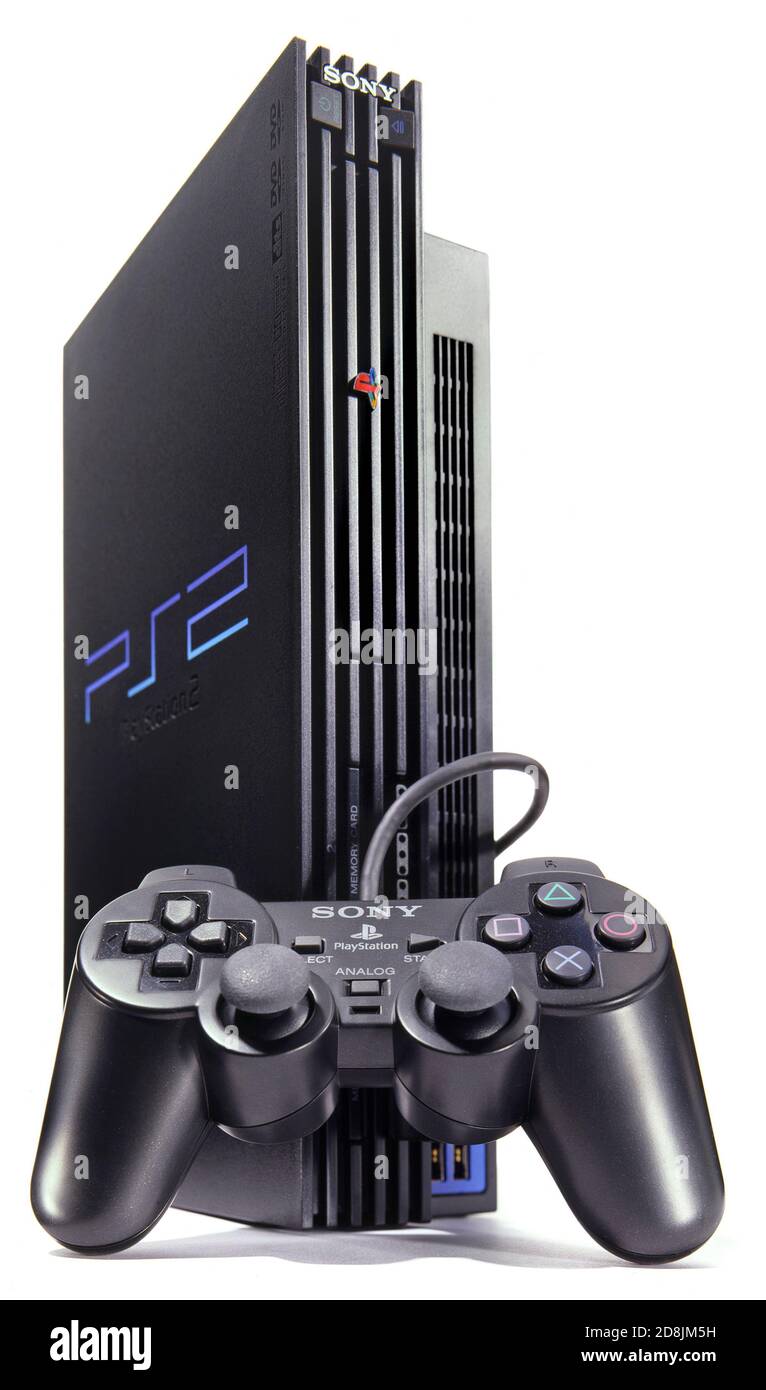 Black PlayStation 2 gaming system and controller photographed on a white background Stock Photo