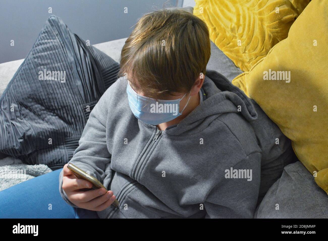 Teenage boy on his smartphone. Stock Photo