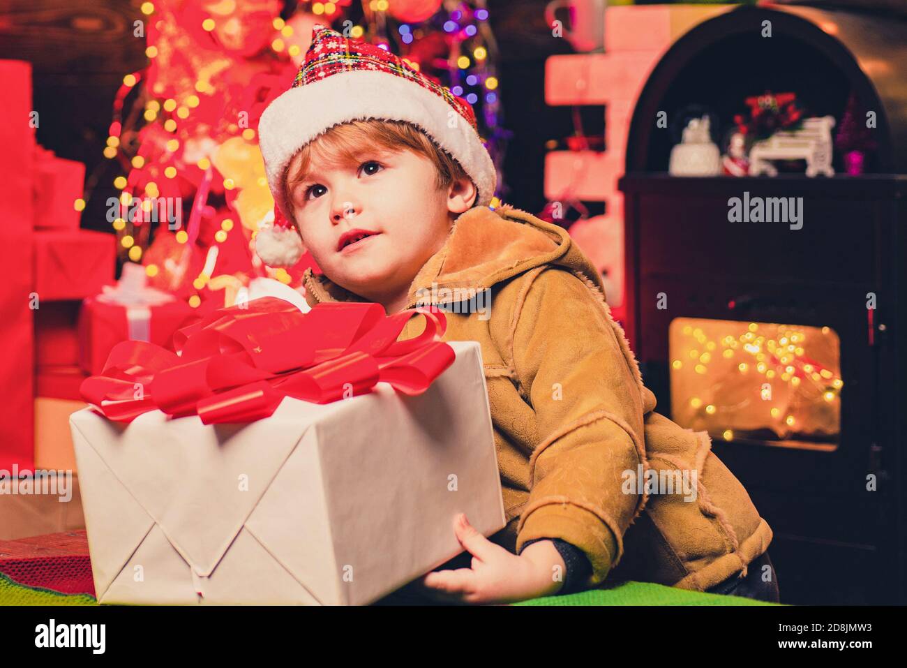 Cute Little Kid Boy Play Near Christmas Tree Kid Enjoy Winter Holiday At Home Home Filled With Joy And Love Best Wishes For You Your Family This Stock Photo Alamy