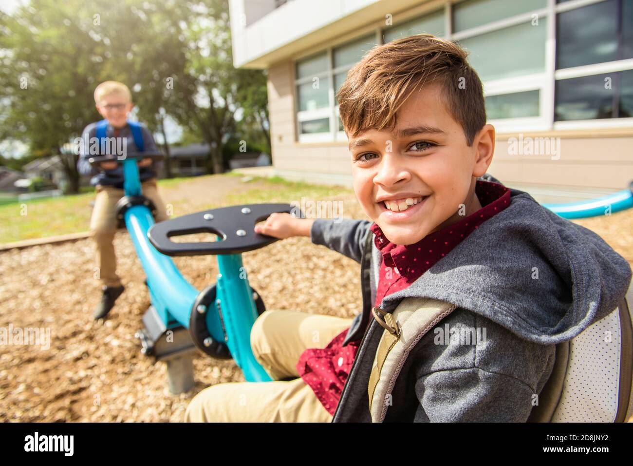 the hispanic boy on the playground on the school day Stock Photo