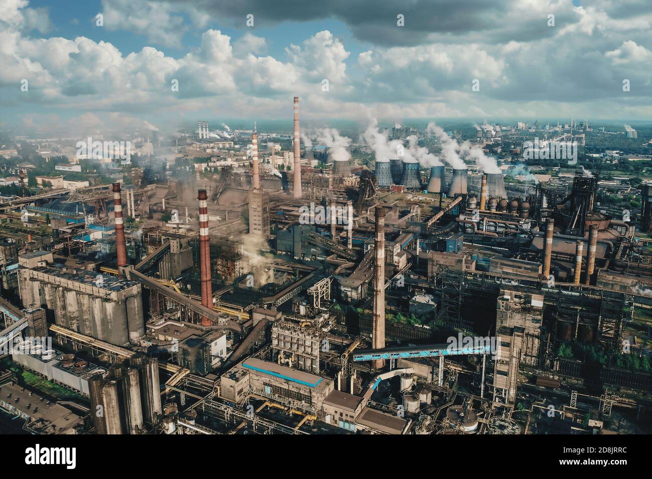 Oil industry. Aerial view of Petrochemical industrial factory, heavy industry, refinery production with smoke pollution. Stock Photo