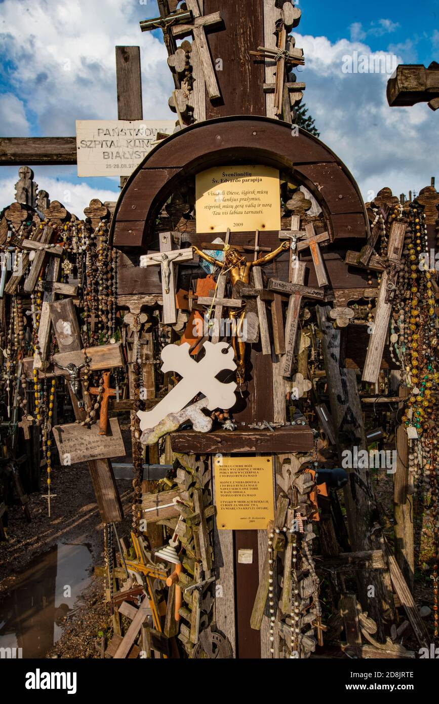 LITHUANIA, SIAULIAI, Small shrine with crucifixes surrounded by wooden crosses on the hill of crosses (Kryzio Kainas) Stock Photo