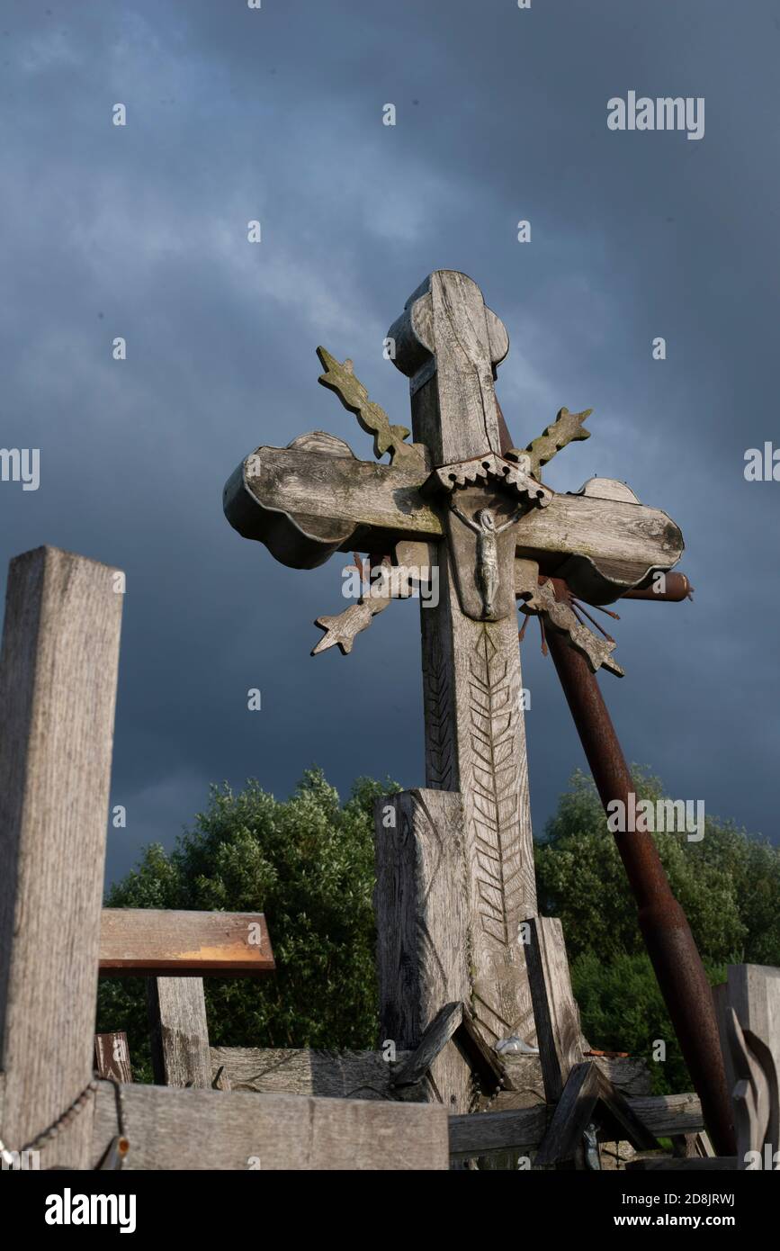 LITHUANIA, SIAULIAI, Cross with crufifix on the hill of crosses (Kryziu Kainas) one of the most important Christian pilgrimage destinations Stock Photo