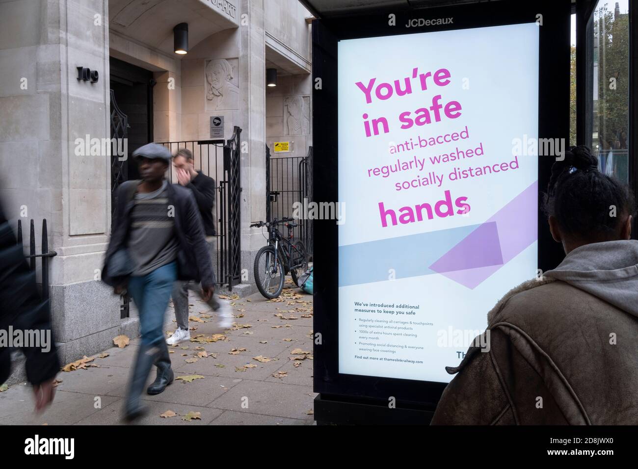 An ad by rail operator Thameslink urges passengers and the wider public to maintain hand hygiene by using anti-viral hand gels, during the second wave of the UK Coronavirus pandemic, on 30th October 2020, in London, England. Stock Photo