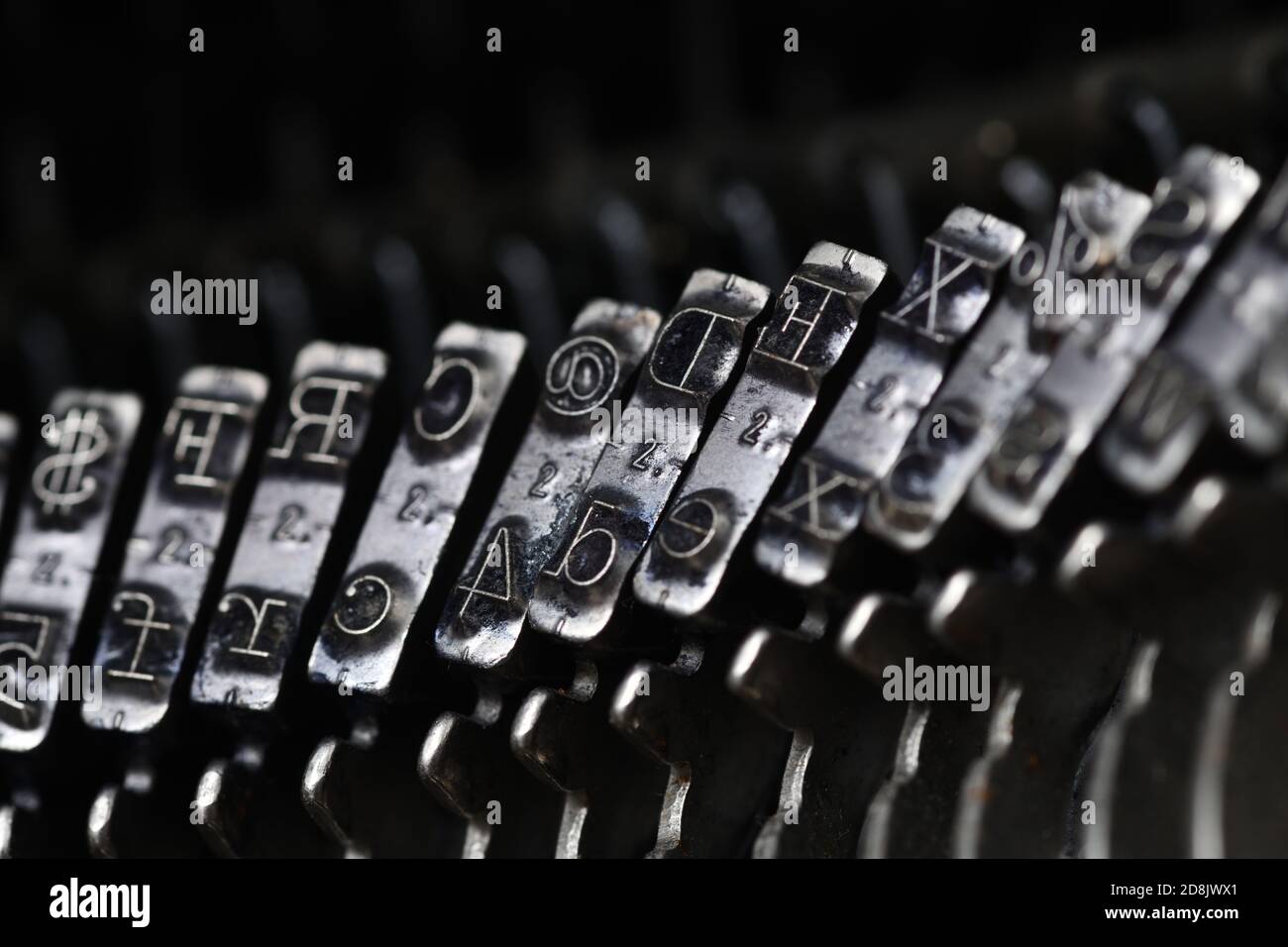details of typewriter hammers showing letters and some symbols Stock
