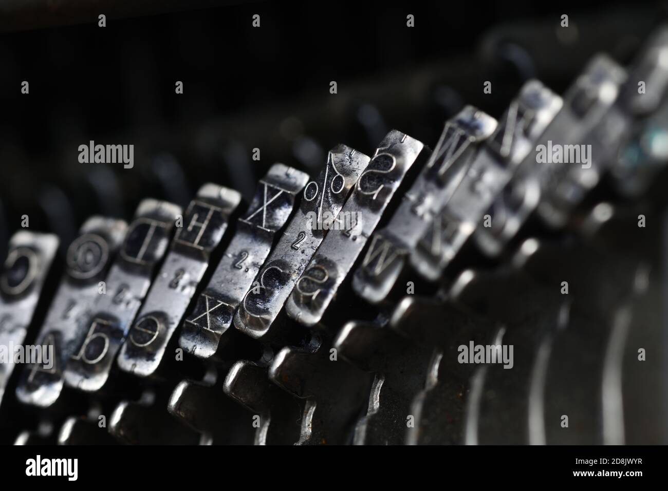 details of typewriter hammers showing letters and some symbols Stock