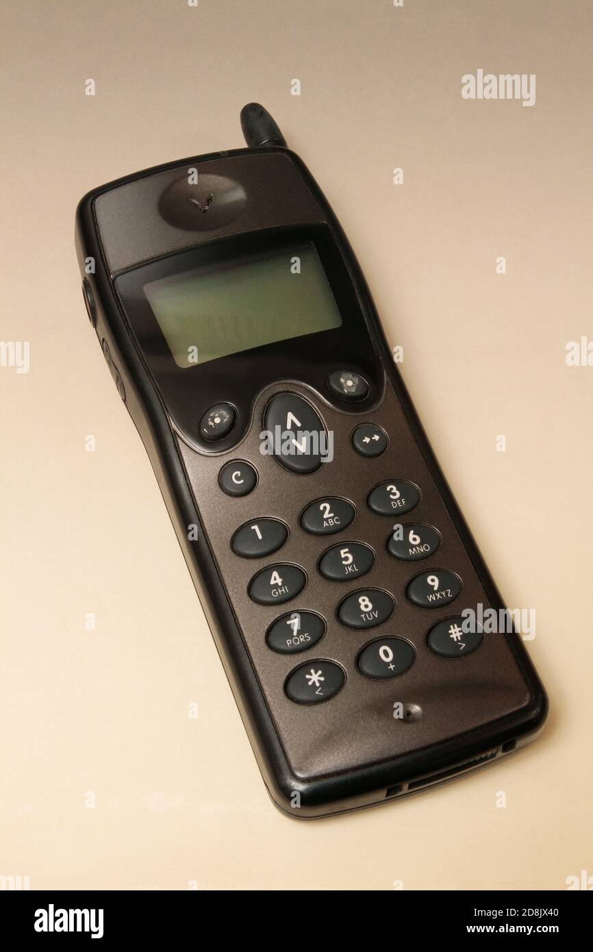 Close up of and old analogue mobile cell phone. Old fashioned black mobile  phone isolated on white background. Vintage mobile phone Stock Photo - Alamy