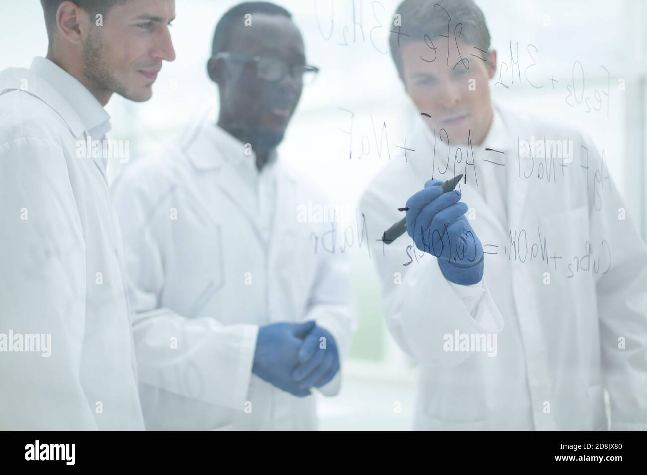 promising scientist makes notes on the Board Stock Photo