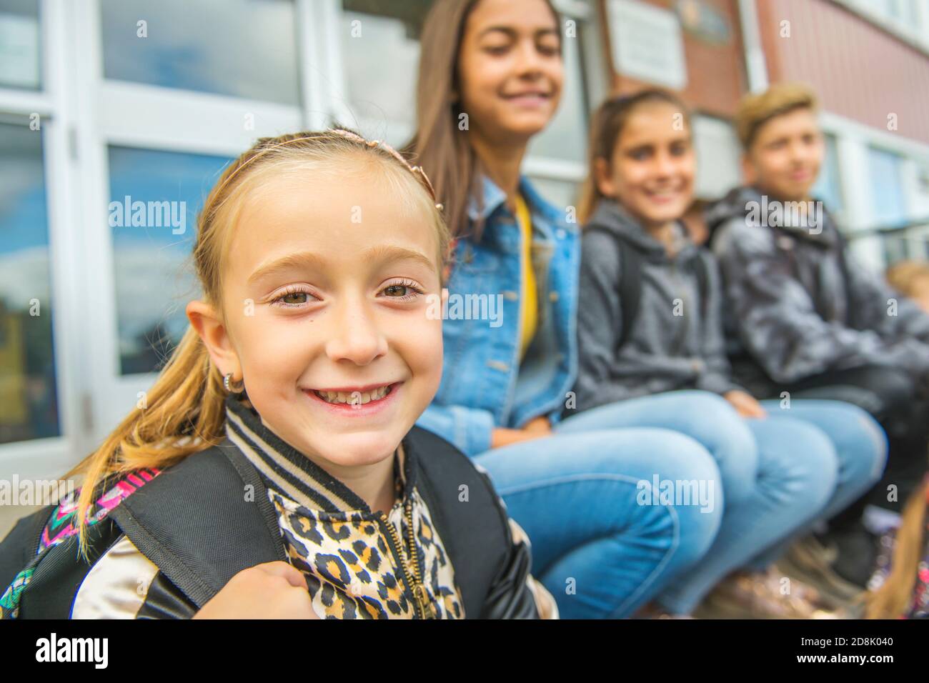 group-of-kids-sit-on-the-school-stairs-having-fun-stock-photo-alamy