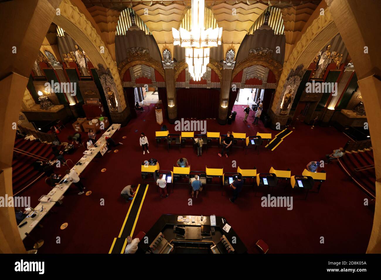 People vote at the Pantages Theater, during the global outbreak of the coronavirus disease (COVID-19), in Hollywood, Los Angeles, California, U.S., October 30, 2020. REUTERS/Lucy Nicholson Stock Photo
