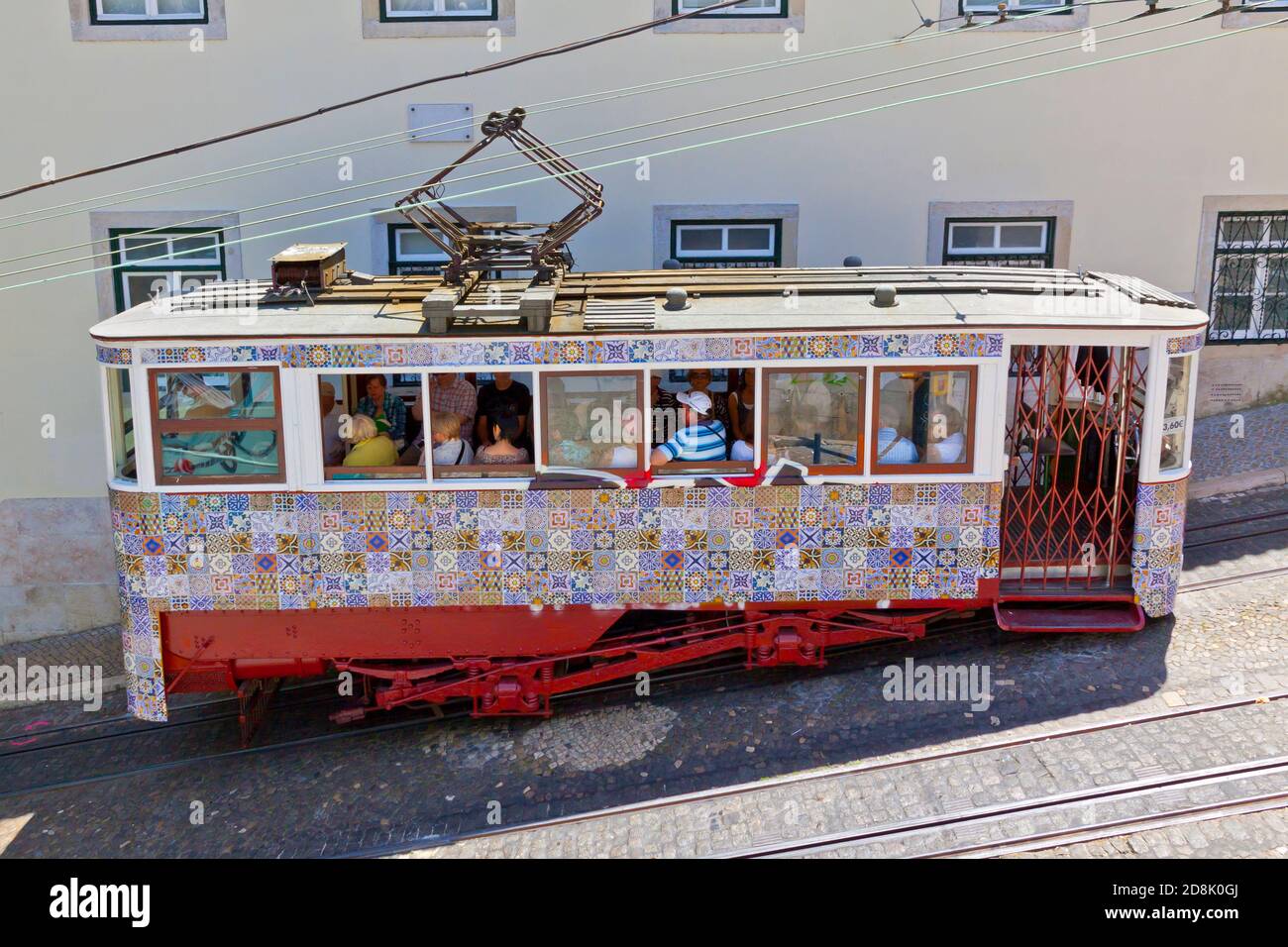 Lisbon, Portugal - June 13, 2013: Carriage of Gloria Funicular decorated with Azulejos tiles in Pombaline downtown of Portuguese capital Lisbon Stock Photo