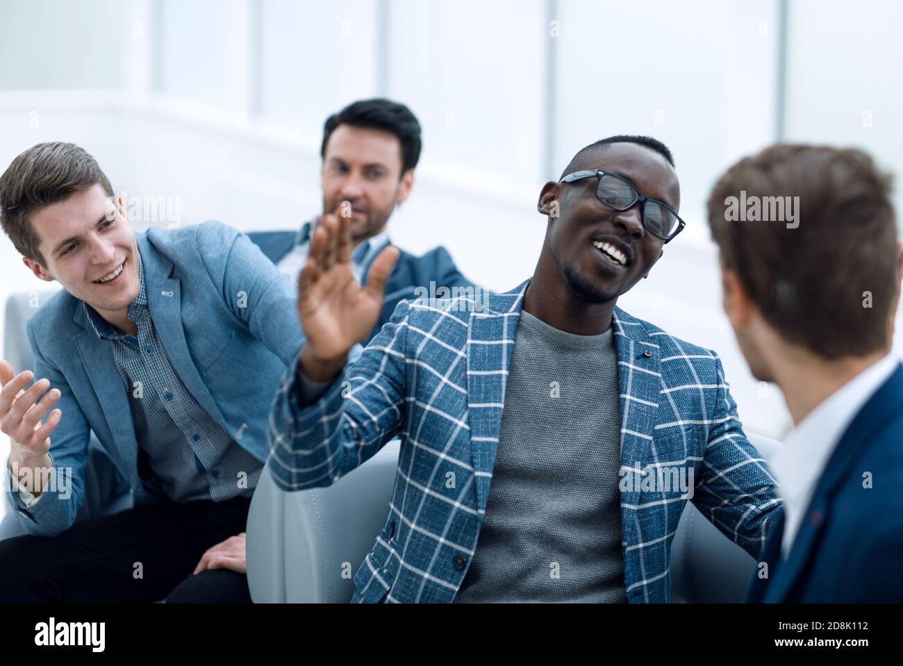 close up.cheerful co-workers giving each other a high five Stock Photo