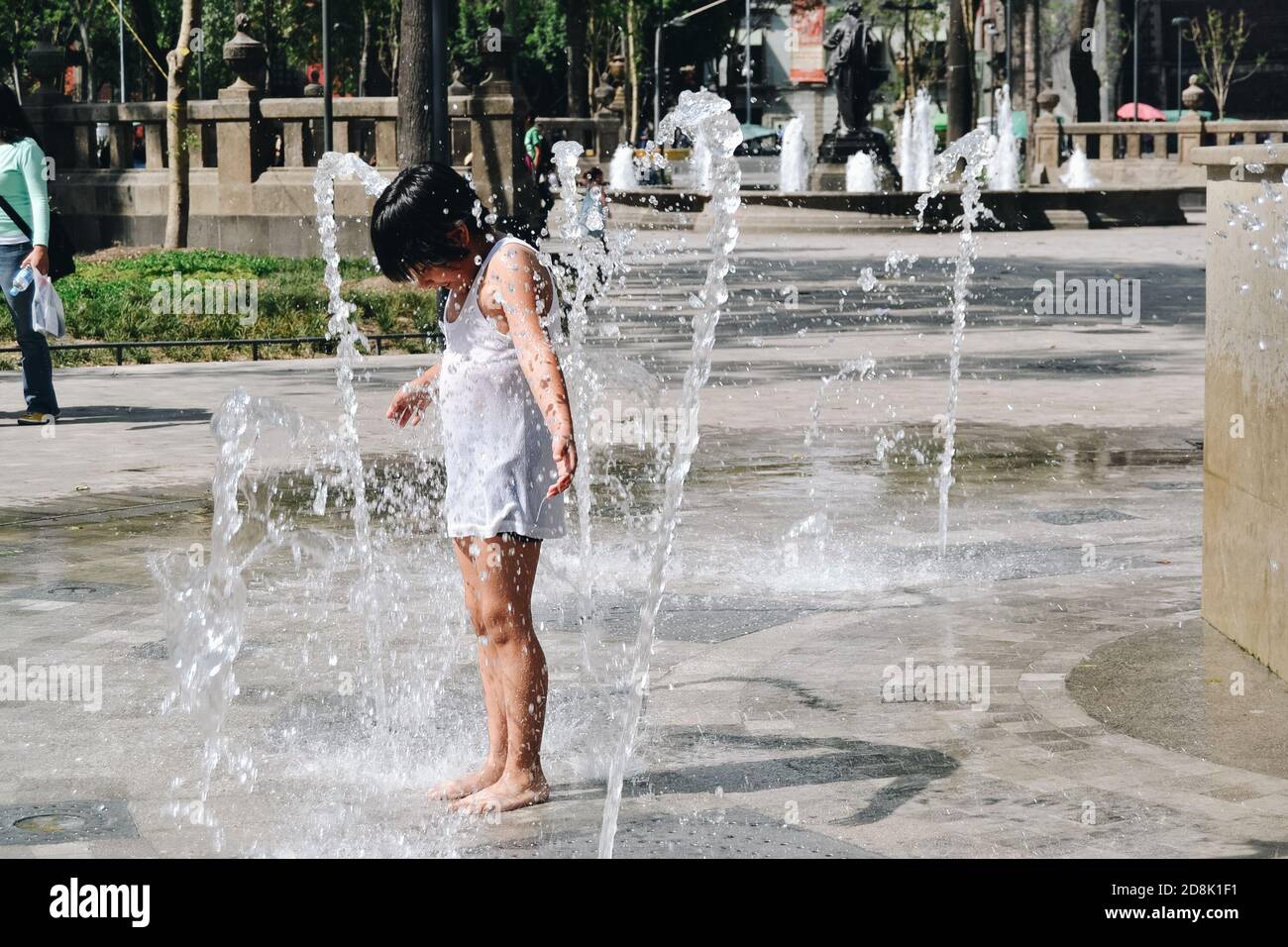 Kids playing in a fountain Stock Photo - Alamy