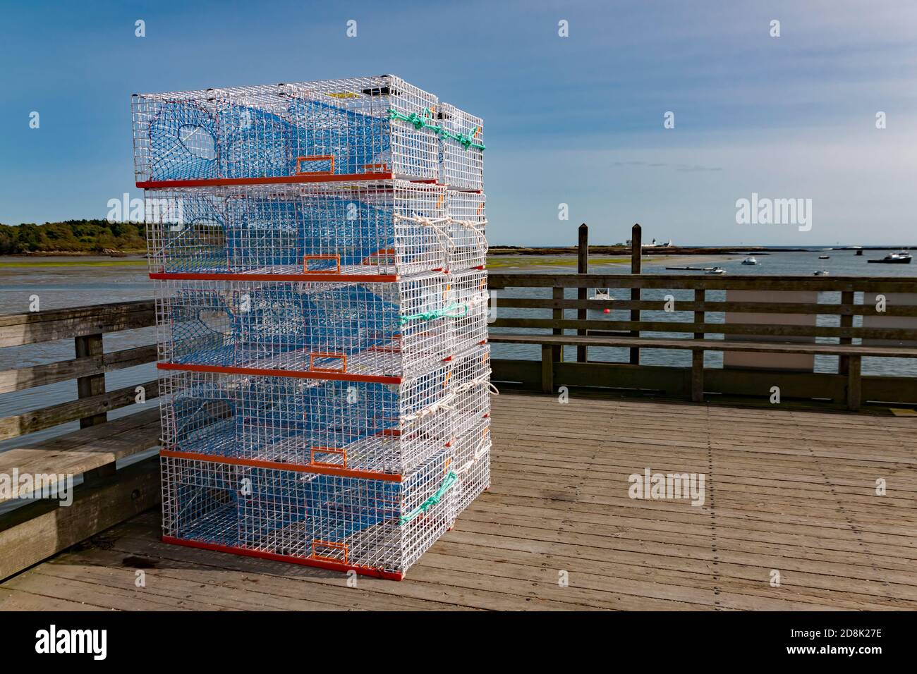 New, unused, welded wire mesh commercial lobster and crab traps stacked on a dock in Kennebunkport, Maine, United States. Stock Photo