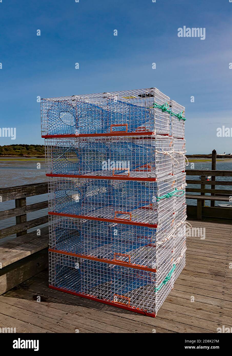 New, unused, welded wire mesh commercial lobster and crab traps stacked on a dock in Kennebunkport, Maine, United States. Stock Photo