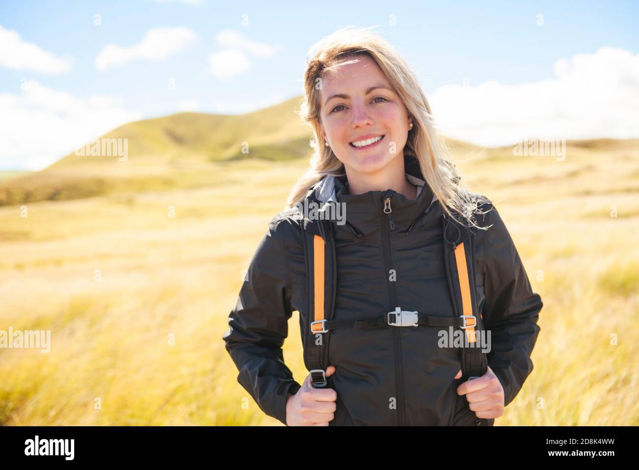 The Successful woman mountain hiker with backpack traveler caucasian ...