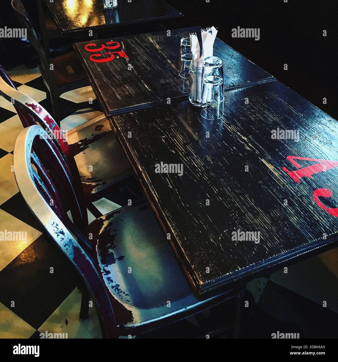 High Angle View of Restaurant Table and Metal Chairs Stock Photo