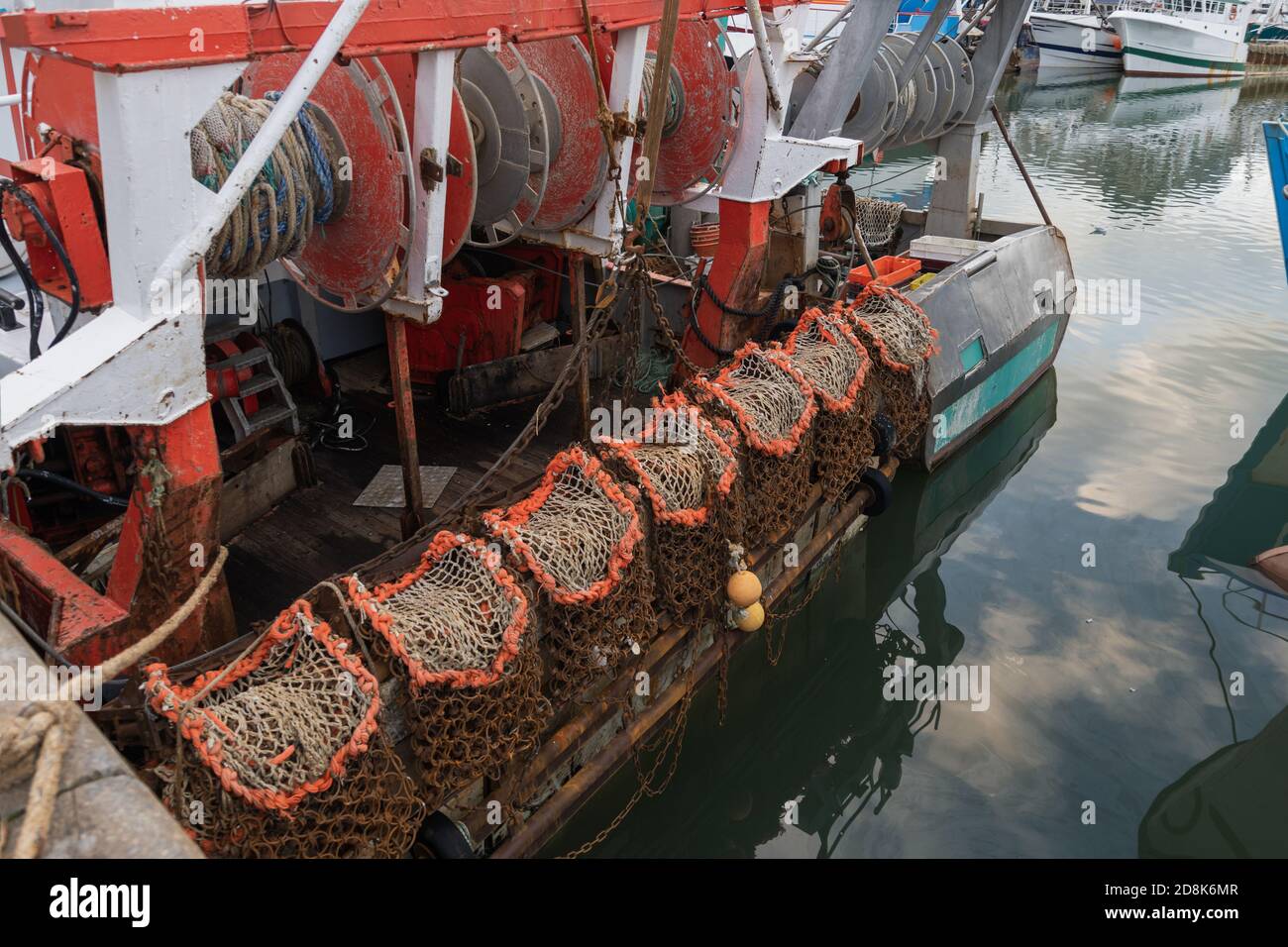 Rusty boat and nets for catching scallops Stock Photo