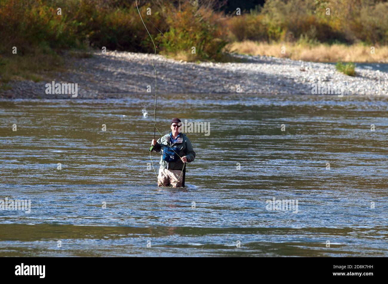Fisherman fly fishing in a river somewhere in the Lower Mainland, B. C., Canada.  Stock photo. Stock Photo