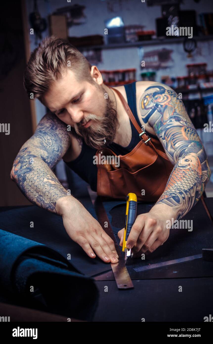 Worker leather works goods hi-res stock photography and images - Alamy