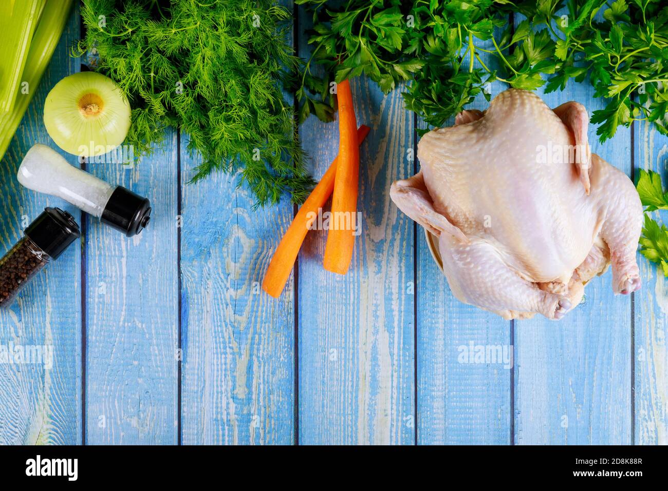 Uncooked whole chicken with vegetable prepared for chicken soup Stock