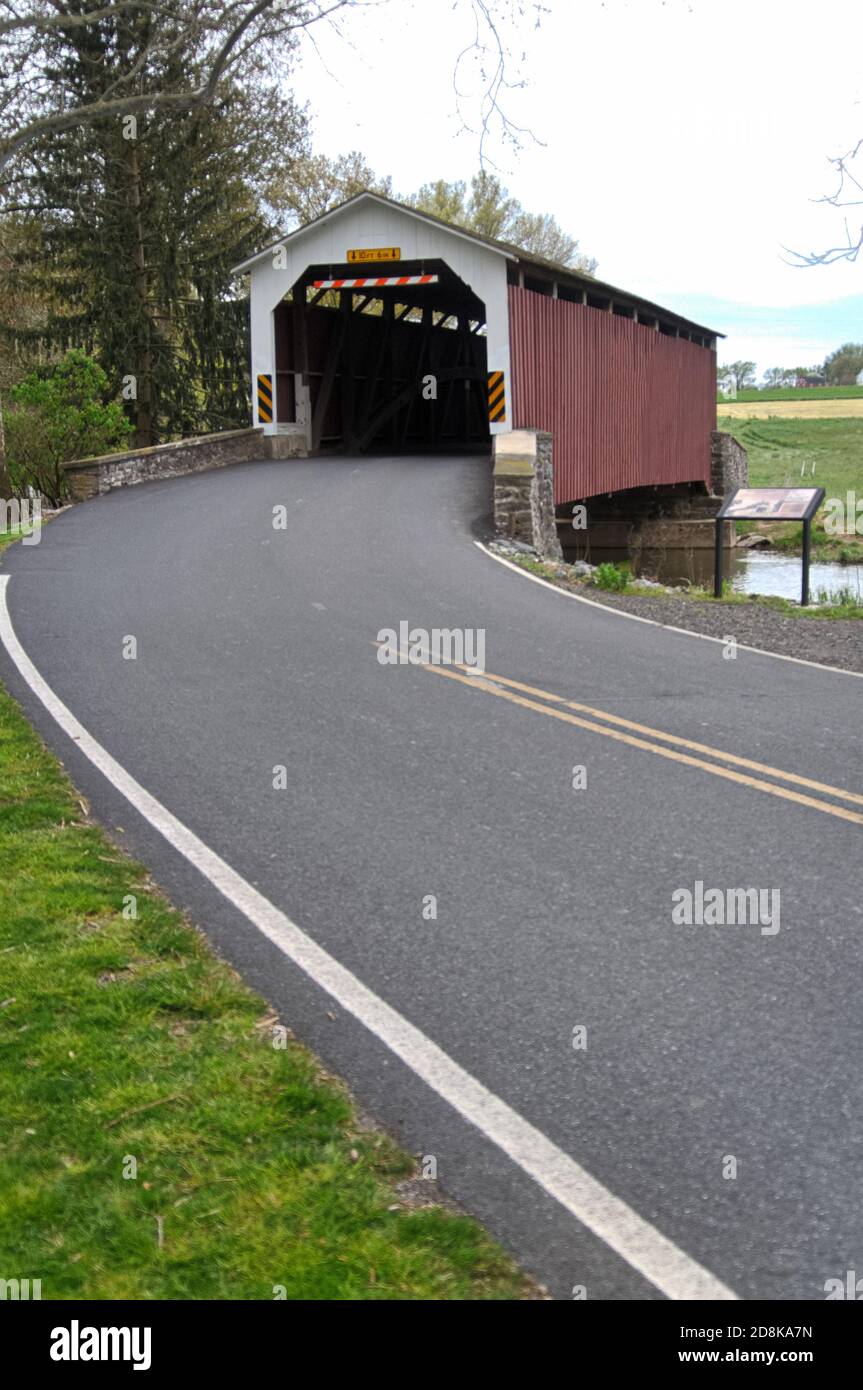 Vertical depiction of road leading up to Erb's Mill covered bridge Stock Photo Alamy