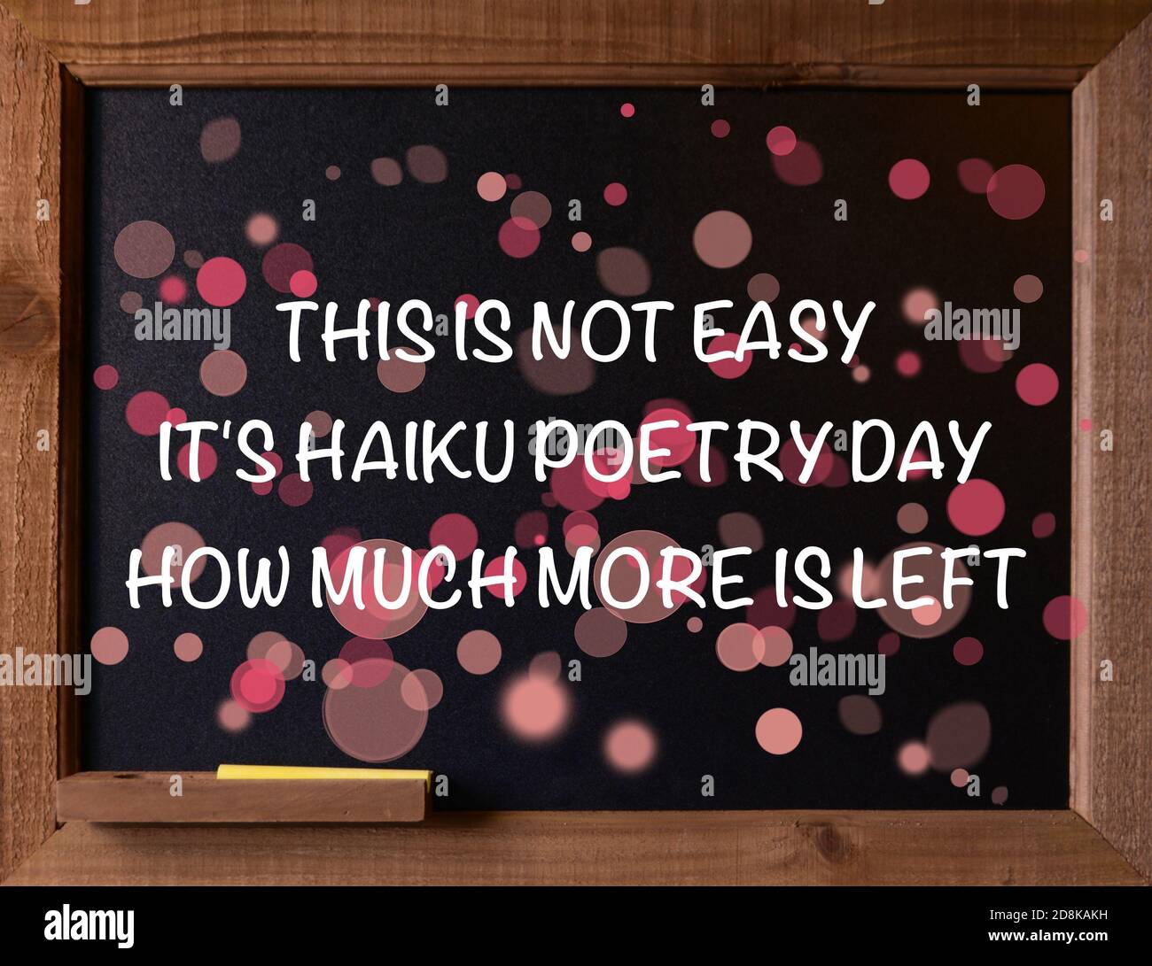 Photo of a black chalkboard with a message for National Holiday, Haiku