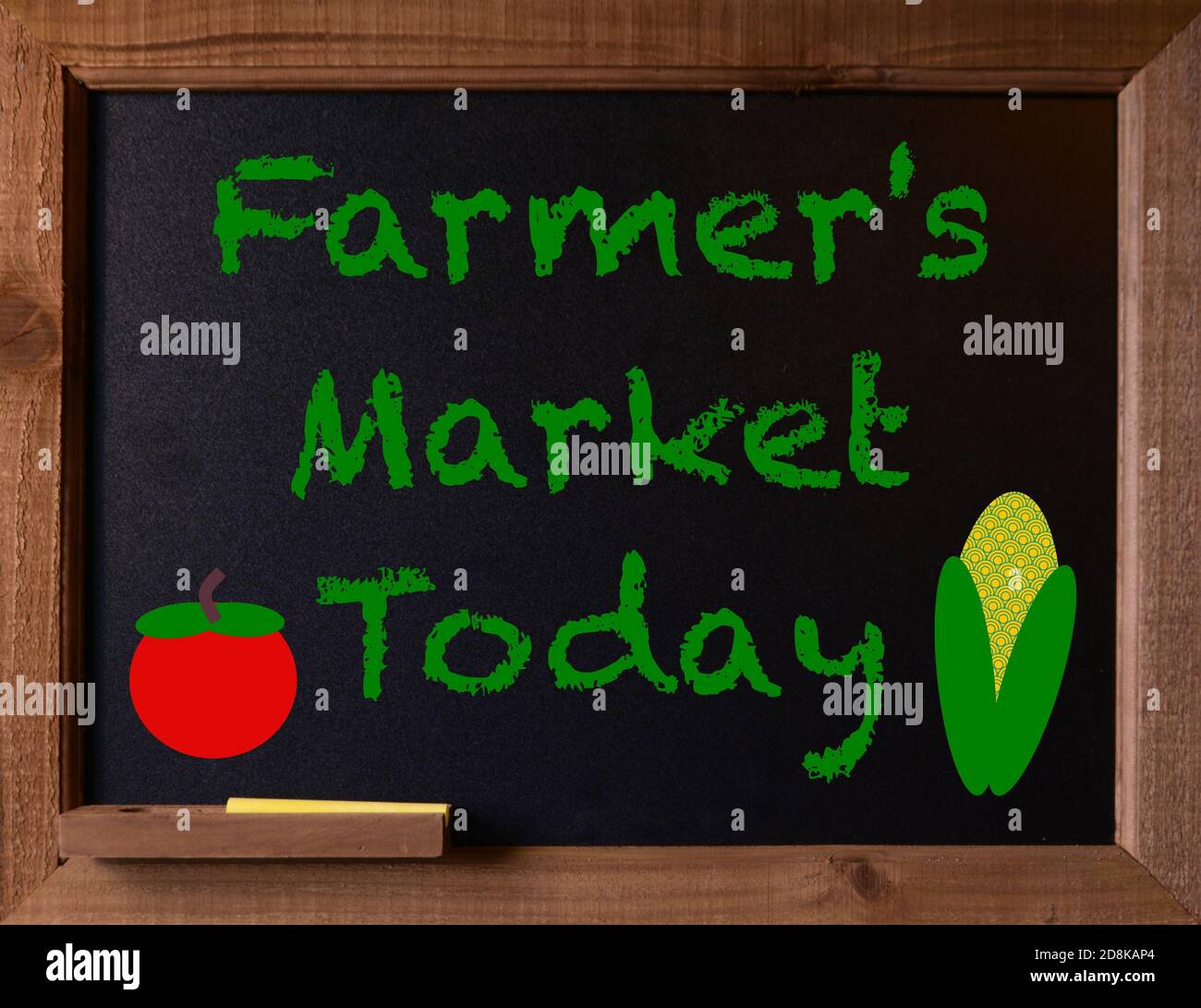 Chalkboard with a message, Farmer's Market Today written on it.  With a simple graphic design of tomato and an ear of corn. Stock Photo