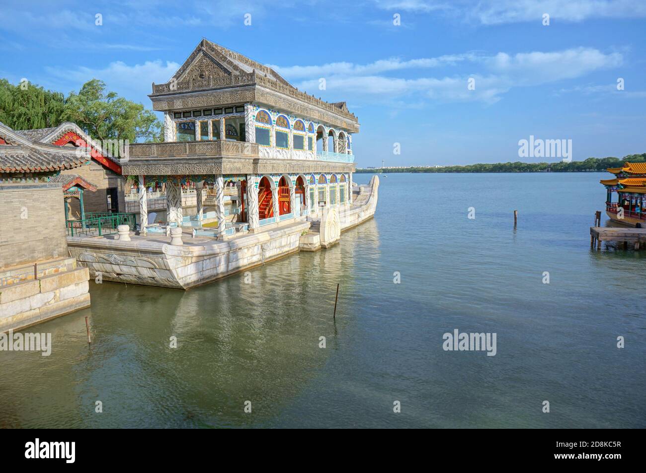 White stone boat in Chinese style with carvings on the lake Stock Photo