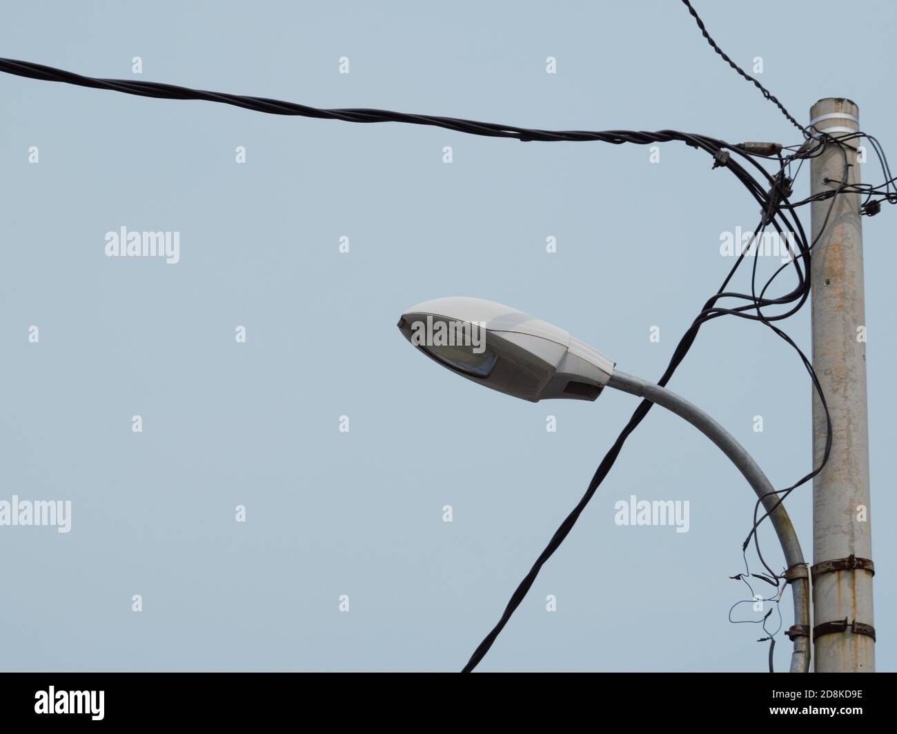 electricity poles and street lights on clear sky Stock Photo Alamy