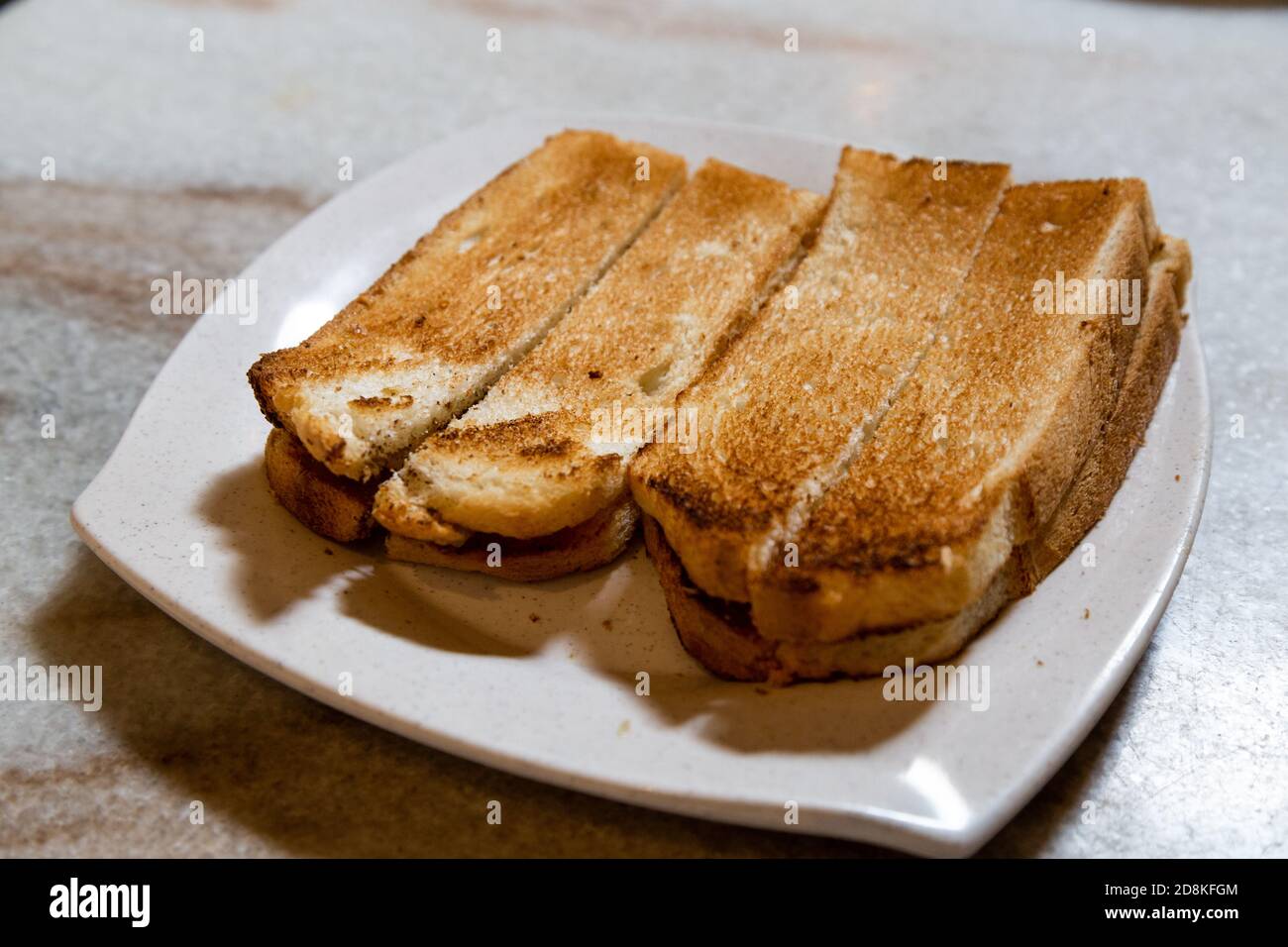 Toast bread in traditional Chinese style with butter and kaya Stock Photo