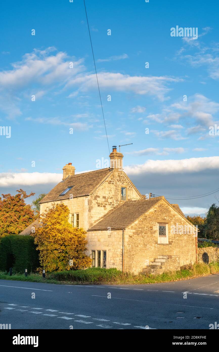 Cotswold stone cottage in the autumn light just after sunrise. Nr  Sheepscombe, Cotswolds, Gloucestershire, England Stock Photo