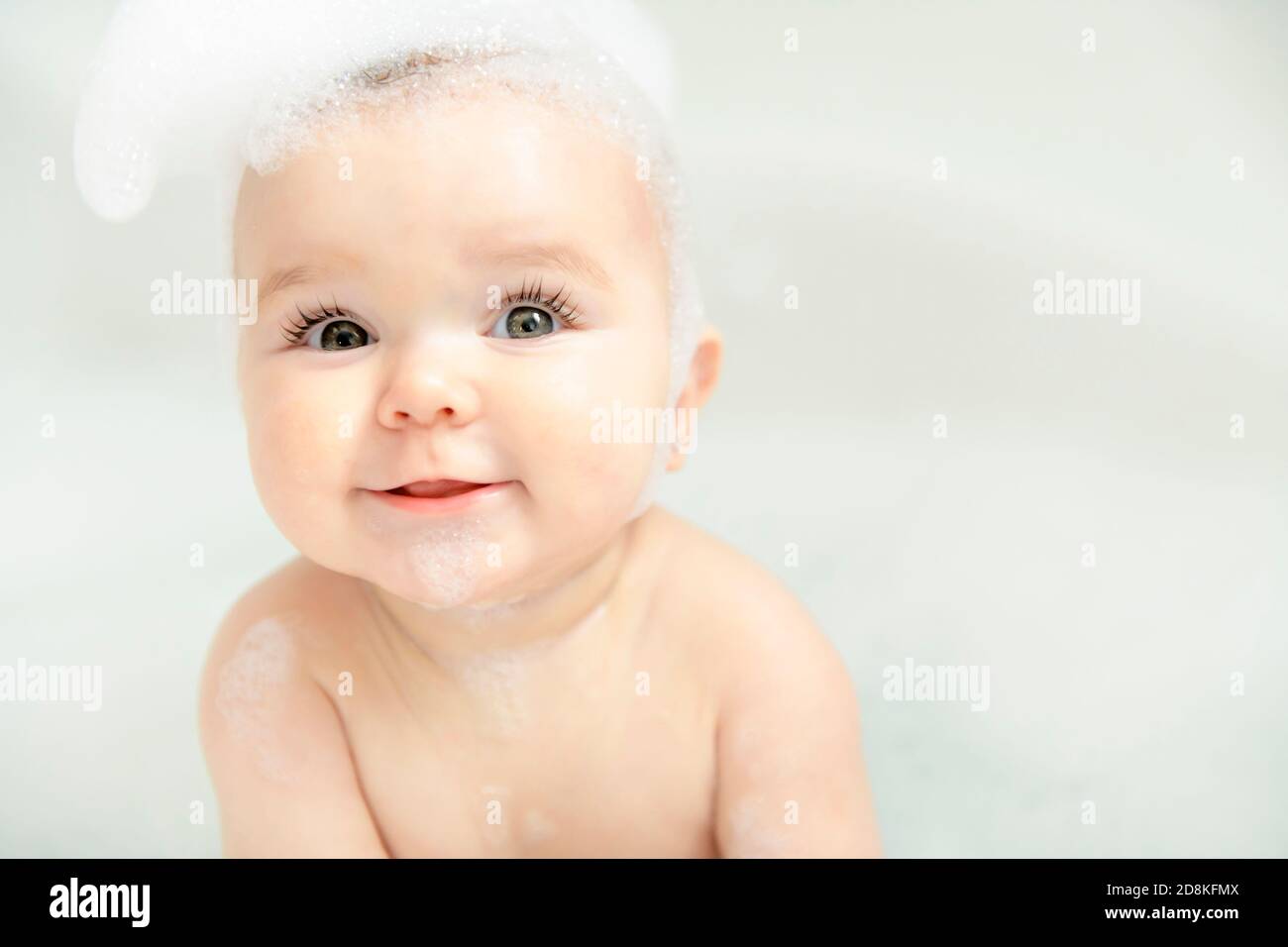 Baby sitting by bubbles hires stock photography and images Alamy