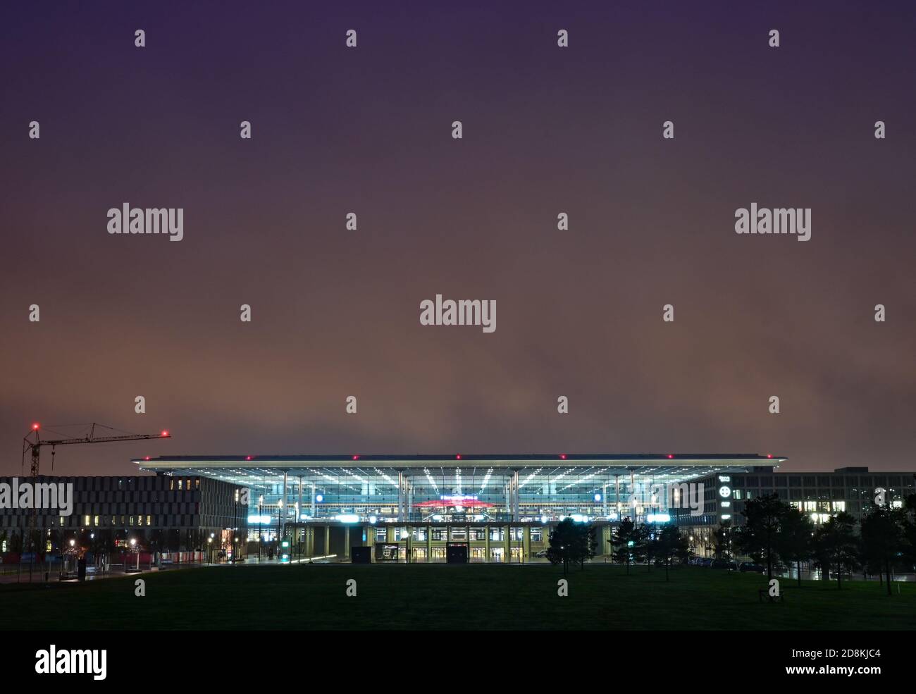 31 October 2020, Brandenburg, Schönefeld: Terminal 1 of the capital airport Berlin Brandenburg 'Willy Brandt' (BER) is illuminated in the early morning. The airport will open on 31.10.2020 after a long delay. Photo: Patrick Pleul/dpa-Zentralbild/dpa Stock Photo