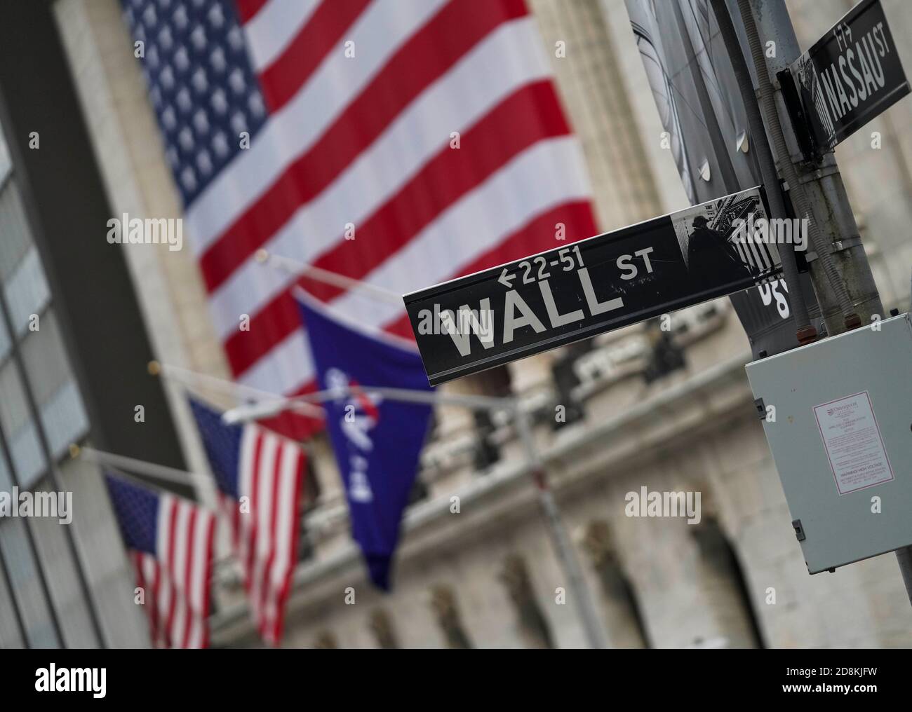 New York, USA. 30th Oct, 2020. A road sign is seen nearby the New York Stock Exchange in New York, the United States, Oct. 30, 2020. U.S. stocks closed lower on Friday, as a pronounced slide in tech sector weighed on the market. The Dow Jones Industrial Average fell 157.51 points, or 0.59 percent, to 26,501.60. The S&P 500 was down 40.15 points, or 1.21 percent, to 3,269.96. The Nasdaq Composite Index shed 274.00 points, or 2.45 percent, to 10,911.59. Credit: Wang Ying/Xinhua/Alamy Live News Stock Photo