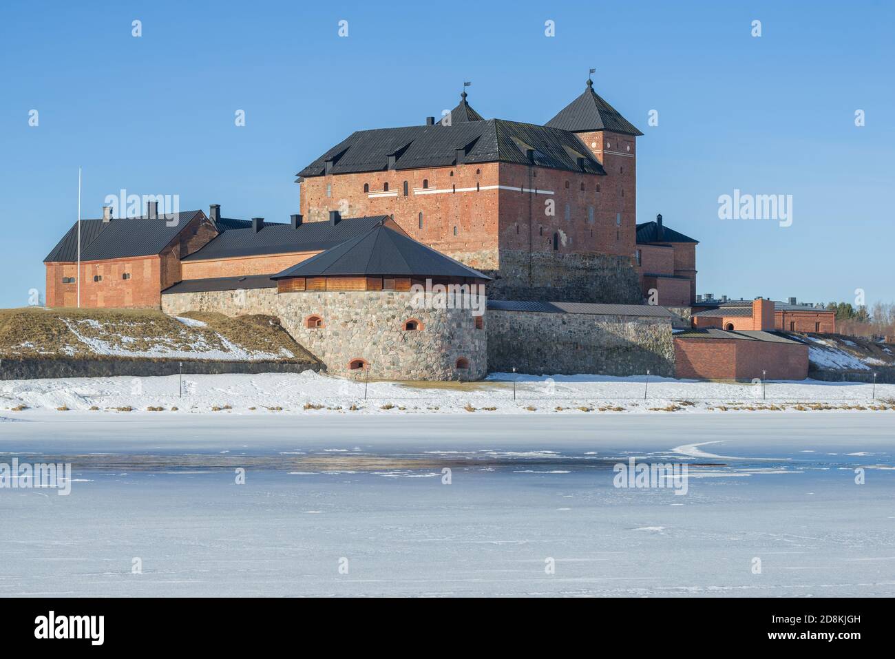 The ancient fortress of Hameenlinna is close-up against the background of a blue cloudless sky. Spring Finland Stock Photo