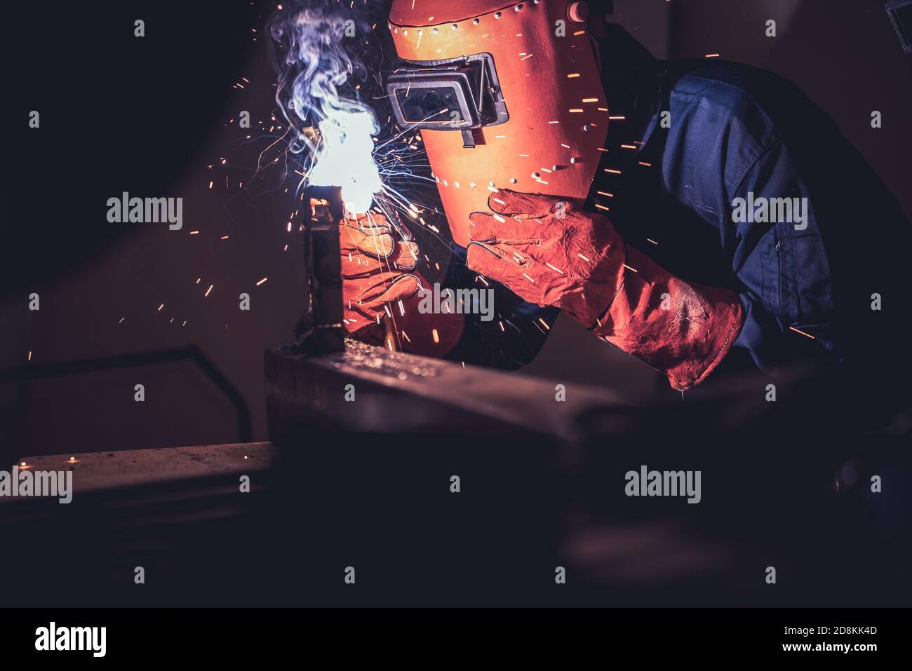 Metal welding steel works using electric arc welding machine to weld
