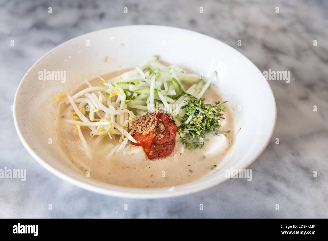 Laksam, flat rice noodle with vegetable in gravy Stock Photo Alamy