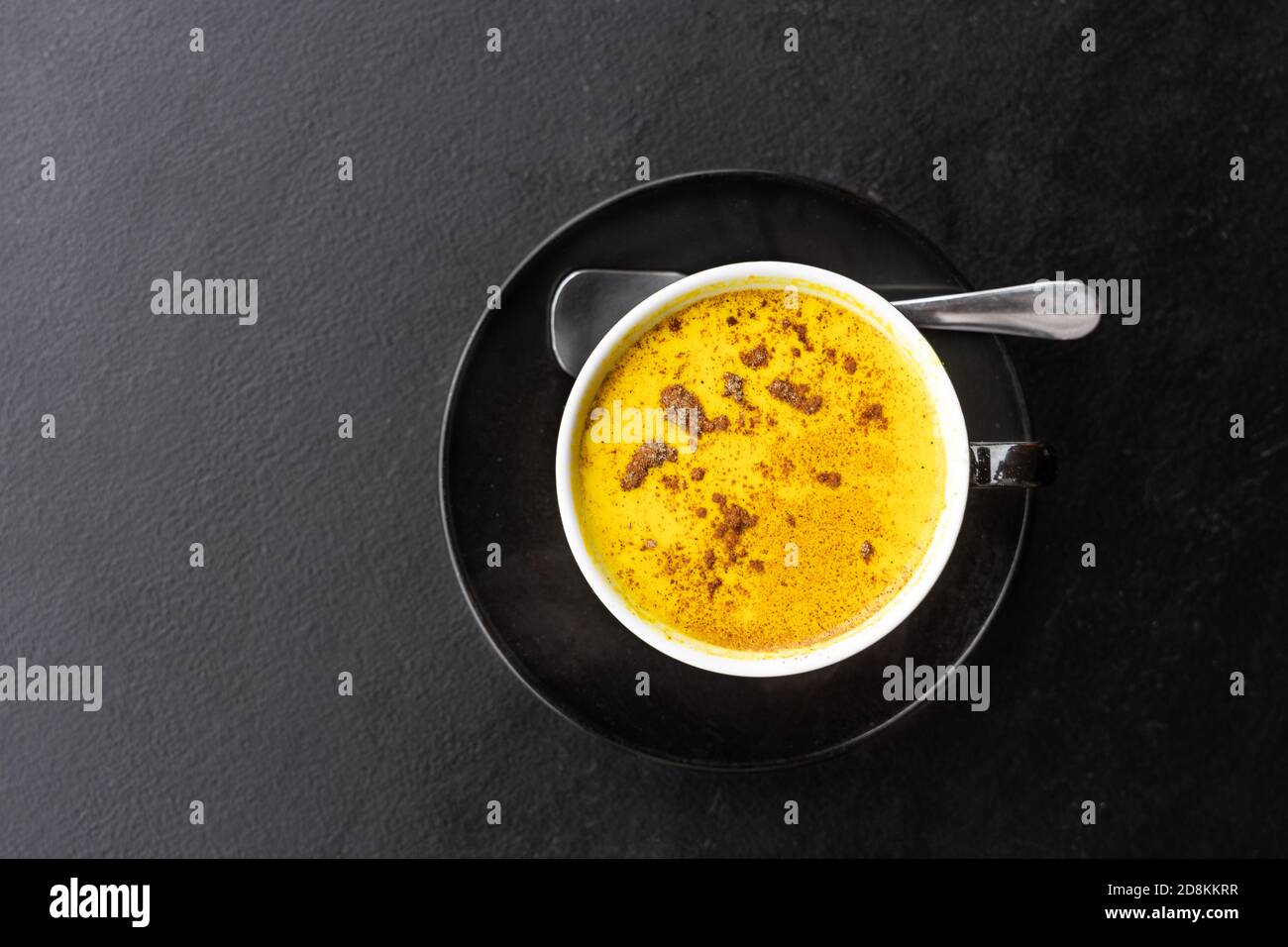 Serving of aromatic turmeric black coffee against dark table Stock ...